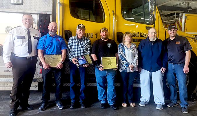 Pictured Sheriff Barry Fitzgibbons, Bobby Schempp, Lester Kiehl, Trevor Moe, Rebecca Campbell, Dennis Campbell, and Pelican Rapids Fire Chief Shad Hanson, at a special presentation of “Life Saving Awards” at the Pelican Rapids Fire Hall April 25.